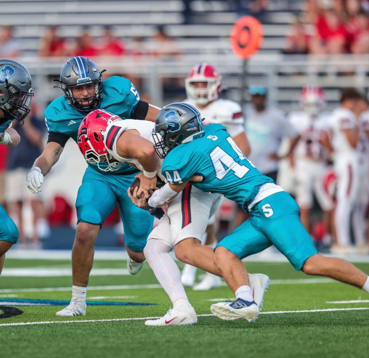 Jaik Chadwick, #44, works to loosen the grip a Notre Dame High School Pioneers football player has on the ball during a game at the new Southside High School stadium, The Reef, on Sept. 5, 2025, in Youngsville, Louisiana.